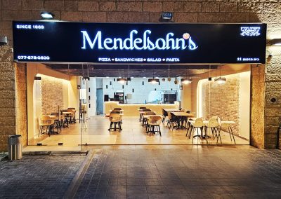 Mendelsohn's Shoppe kosher pizza restaurant storefront with dine-in seating, Givat Shaul Jerusalem, since 1969